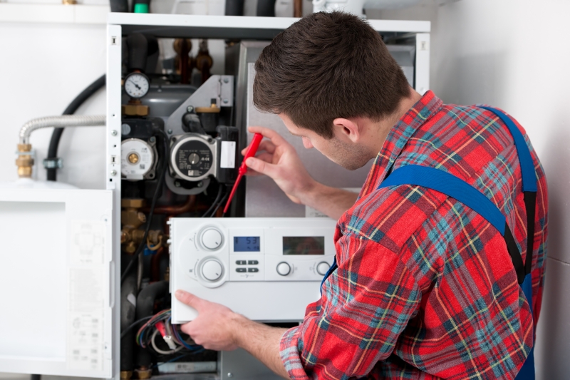 Gas Safe engineer working on a boiler in Finchley Central